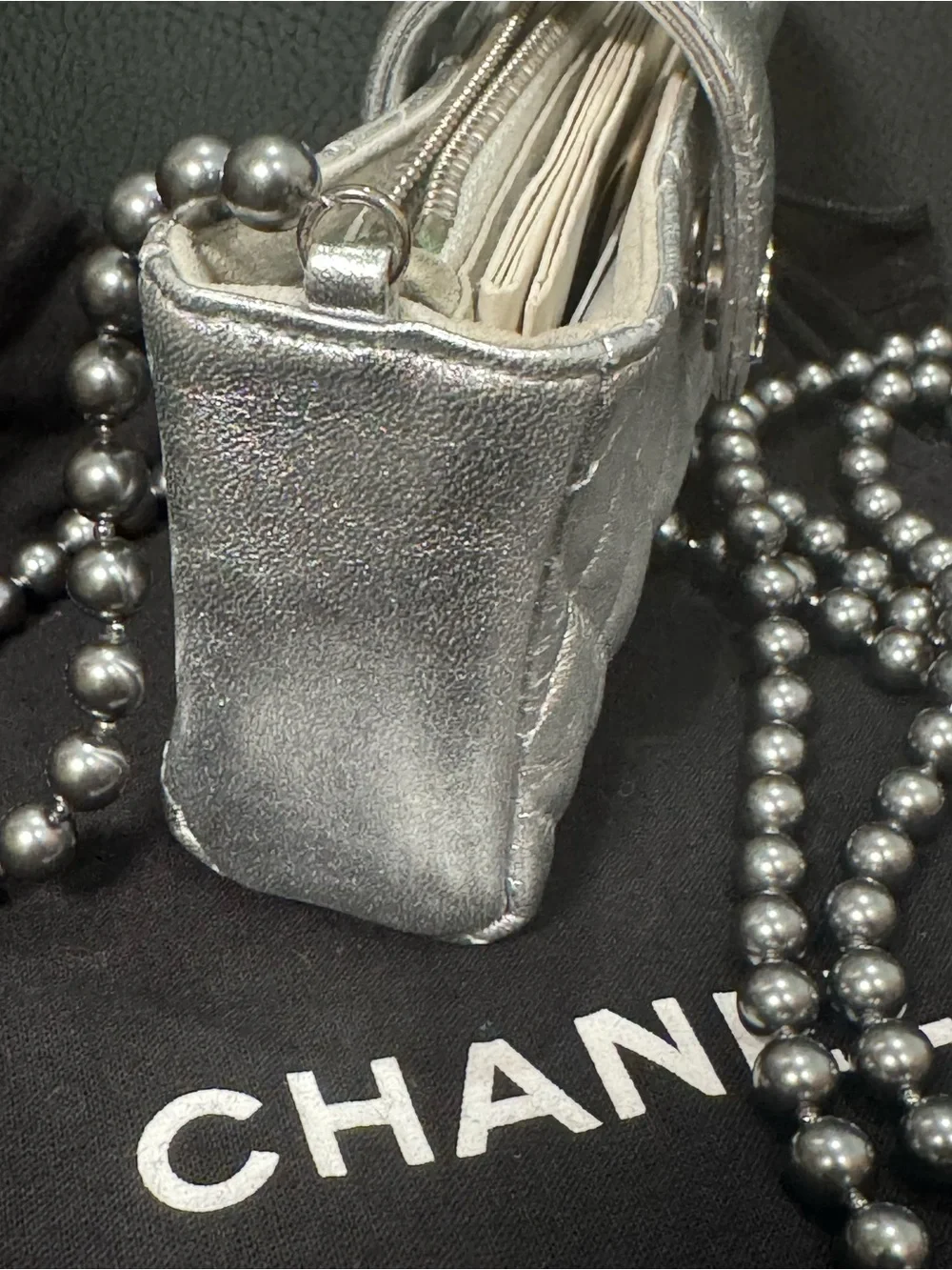 CHANEL Silver Quilted Leather O-Phone Holder with Pearl Chain.